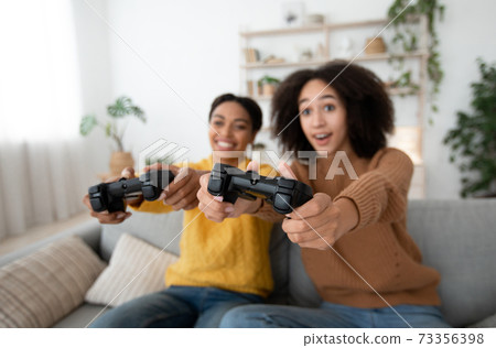 Xbox, enjoying of playing in video game on playstation and rest at home 73356398