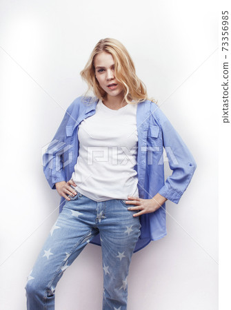 young pretty stylish blond hipster girl posing emotional isolated on white background happy smiling cool smile, lifestyle people concept young pretty stylish blond hipster girl posing emotional isolated on white background happy smiling cool smile, lifestyle people concept 73356985