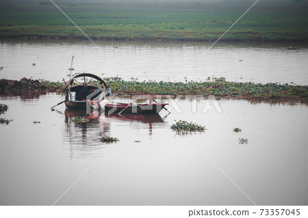 Cinematic scenery of a foggy morning in Yen Thang Lake in Ninh Binh Vietnam Cinematic scenery of a foggy morning in Yen Thang Lake in Ninh Binh Vietnam 73357045