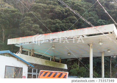 Crushed gas station in the mountains Crushed gas station in the mountains 73357349