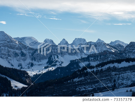 View over the mountain ridges of Alpstein and Kurfirsten, Switzerland 73357379