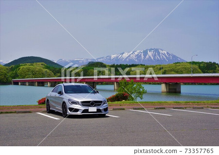 Lake Gosho in spring and Mt. Iwate with residual snow Lake Gosho in spring and Mt. Iwate with residual snow 73357765