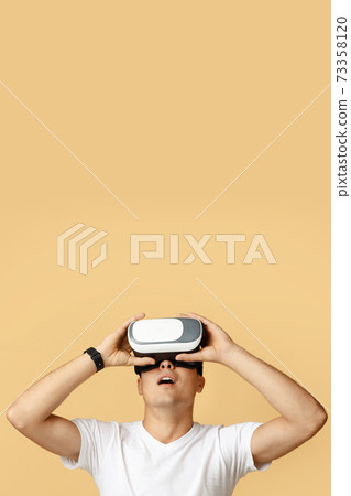 Vr gadget for entertainment and work. Shocked european millennial male with open mouth in virtual reality glasses 73358120