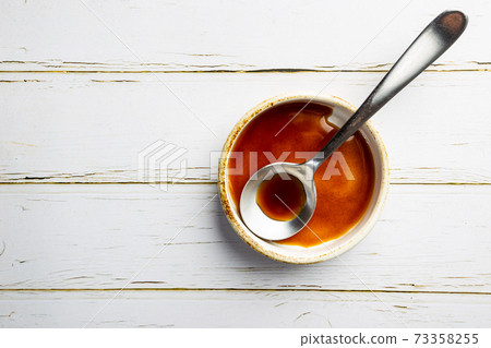 Worcestershire sauce in a bowl 73358255