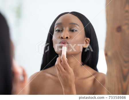 Beauty blogger does make up, reviews product for video blog, gives advice to females, films process Beauty blogger does make up, reviews product for video blog, gives advice to females, films process 73358986