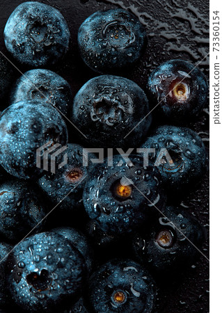 Fresh natural antioxidant blueberries pile, macro detailed close up Fresh natural antioxidant blueberries pile, macro detailed close up 73360154