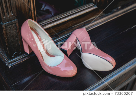 Pair of Womans beige lacquered shoes. Natural light Pair of Womans beige lacquered shoes. Natural light 73360207