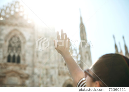 Tourist near the Duomo in Milan Tourist near the Duomo in Milan 73360331