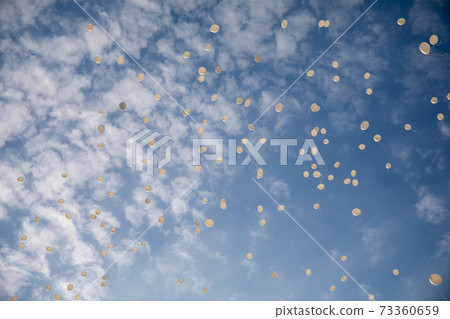 White balloons in the blue sky White balloons in the blue sky 73360659