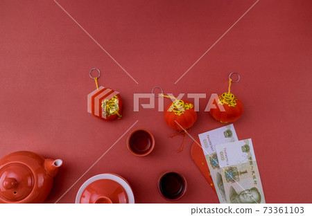 Asian traditional Chinese tea culture with Chinese New Year decoration mandarin orange on red table Asian traditional Chinese tea culture with Chinese New Year decoration mandarin orange on red table 73361103
