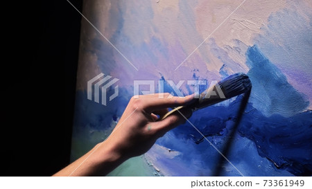 Artist copyist paint seascape with ship in ocean. Craftsman decorator draw as boat sail on blue sea with acrylic oil color. Draw brush, knife palette. 73361949