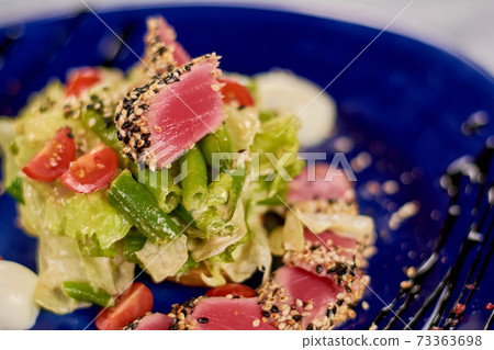 Close up of delicious fresh salad. 73363698