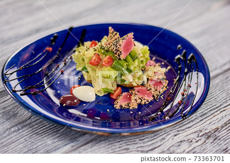Appetizing nisuaz salad with tuna. 73363701