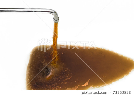Rusty or dirty water flowing from a tap into a white bathtub or sink Rusty or dirty water flowing from a tap into a white bathtub or sink 73363838