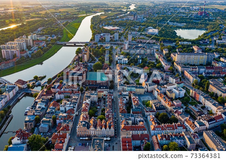 Drone view of Opole Old Town and Oder river. Poland, summer day. Drone view of Opole Old Town and Oder river. Poland, summer day. 73364381