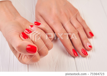 Valentine nail art manicure. 73364723