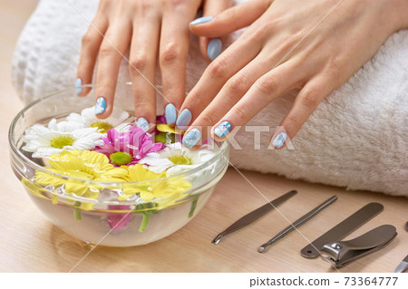 Spa treatment for female hands. 73364777