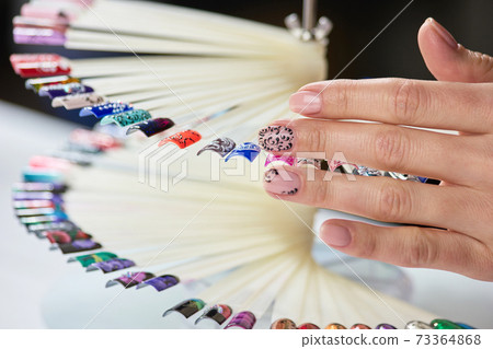 Female manicured hand and nails samples. 73364868