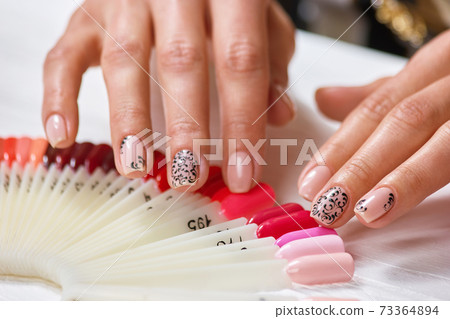 Beautiful nails with beige manicure. Beautiful nails with beige manicure. 73364894