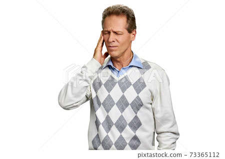 Middle-aged man suffering from migraine. Middle-aged man suffering from migraine. 73365112