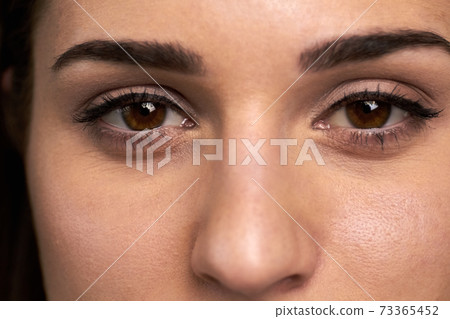 Close up open female eyes. Close up open female eyes. 73365452