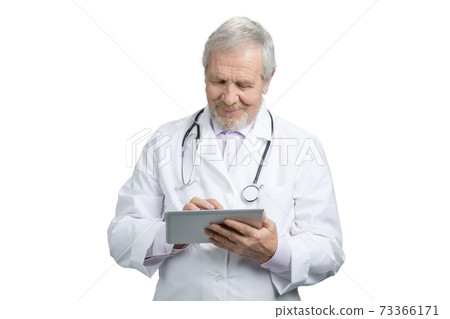 Old senior doctor with tablet. 73366171