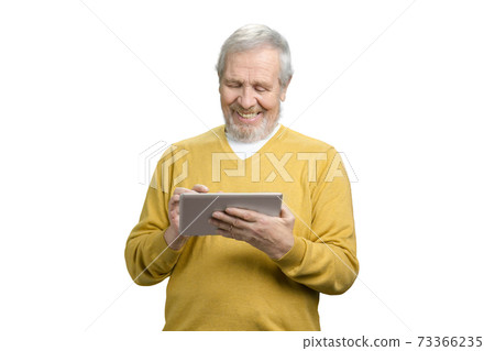 Old grandpa using tablet. Old grandpa using tablet. 73366235
