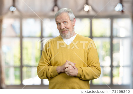 Portrait of surprised grandfather. 73366240