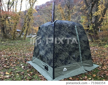 Russian Morzhi tent sauna. Outdoor sauna scenery at the campsite. Russian Morzhi tent sauna. Outdoor sauna scenery at the campsite. 73368354