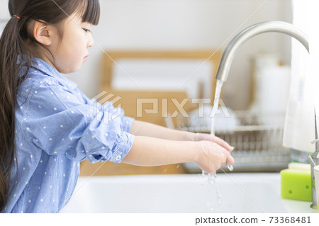 A child washing hands A child washing hands 73368481