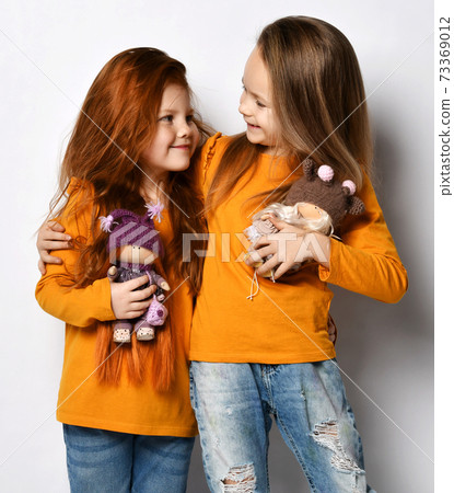 Portrait of two happy kid girls best friends in 73369012