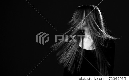 Black and white portrait of young happy woman with Black and white portrait of young happy woman with 73369015