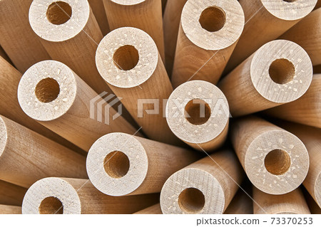 Turned wooden legs folded like a flower. Close-up 73370253