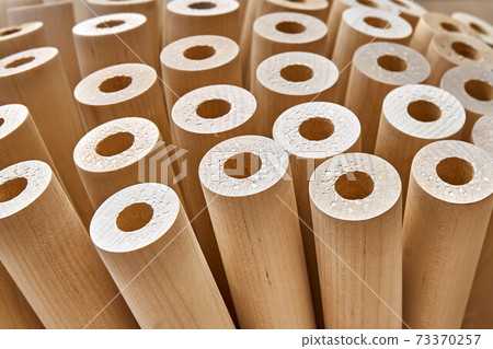Turned wooden legs folded like a flower. Close-up 73370257