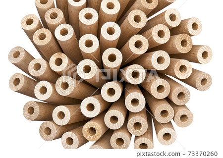 Inverted wooden table leg bunch isolated on white background 73370260