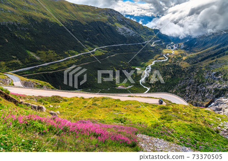 Alpine landscape with curved road,Furka Pass,Switzerland,Europe 73370505