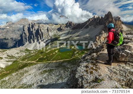 Sporty hiker woman on the Toblin tower peak,Dolomites,Italy Sporty hiker woman on the Toblin tower peak,Dolomites,Italy 73370534