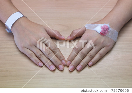 Patients hands Patients hands 73370696