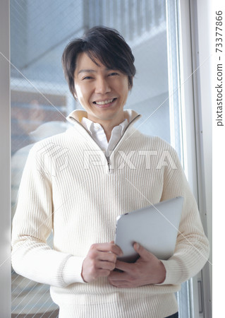 A man with a tablet PC A man with a tablet PC 73377866