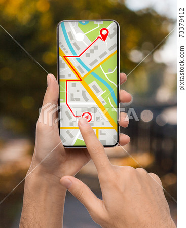 Man Planning Route To Destination Point, Using Gps App On Smartphone 73379412