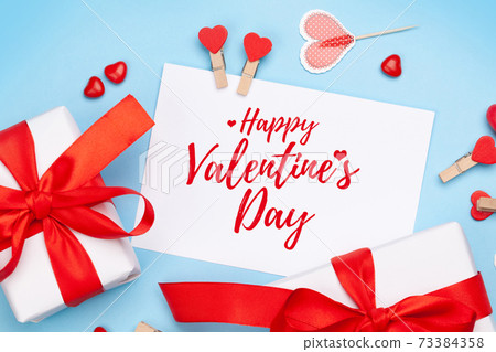 Valentines day. Gift boxes, heart decor and candy sweets Valentines day. Gift boxes, heart decor and candy sweets 73384358