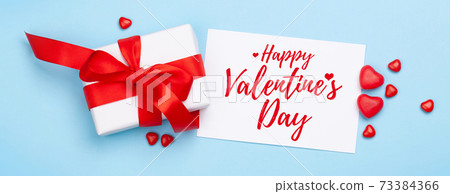Valentines day. Gift box and heart candy sweets Valentines day. Gift box and heart candy sweets 73384366