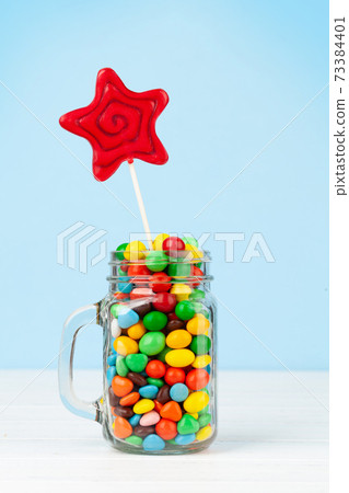 Various candy sweets and lollipop 73384401