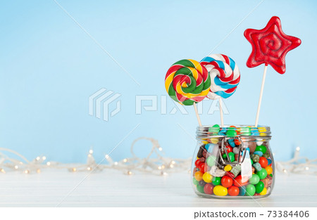 Various candy in glass can Various candy in glass can 73384406