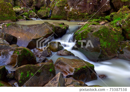 Carpathians. Skole. Waterfall on a mountain river. 73387538
