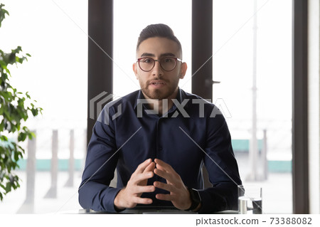 Arabic businessman talk on video call in office 73388082