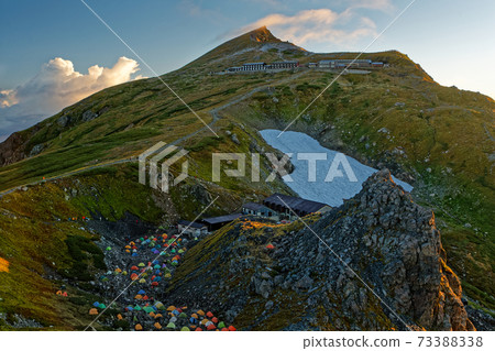 The summit of Mt. Shirouma in early autumn in the Asahi The summit of Mt. Shirouma in early autumn in the Asahi 73388338