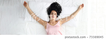 Cute lady dreaming at home 73389045
