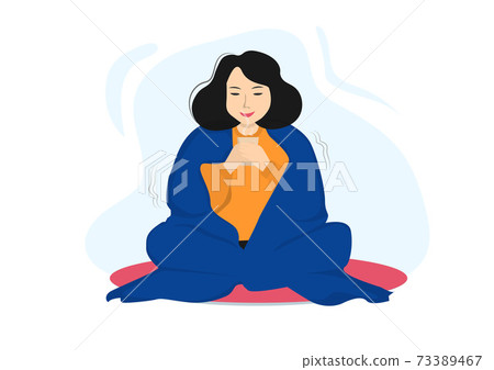 A woman happy to relax, drink tea, cover her body with a blanket. 73389467