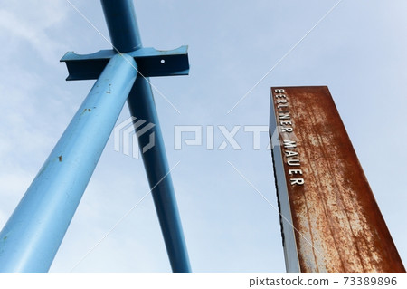 Berlin wall symbol between east and west side, Germany 73389896